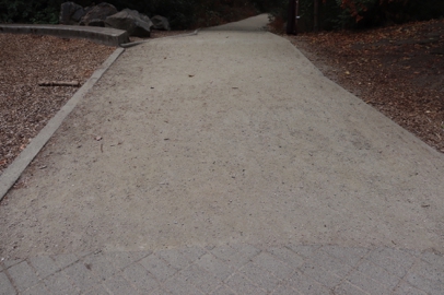 Transition from pavement to compacted gravel trail at playground – leading to trailhead